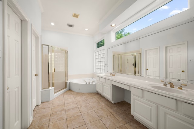 1922 Stormcroft Cir, Katy, TX 77450 - full bathroom with a bath, double vanity, a stall shower, tile patterned flooring, and recessed lighting