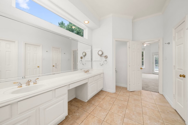 1922 Stormcroft Cir, Katy, TX 77450 - full bathroom featuring double vanity, ornamental molding, tile patterned floors, healthy amount of natural light, and a towering ceiling