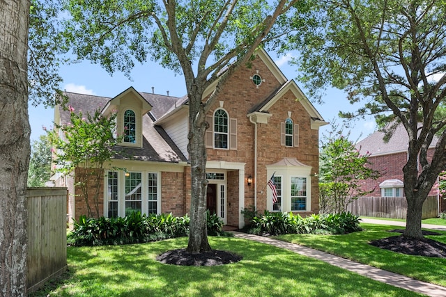1922 Stormcroft Cir, Katy, TX 77450 - traditional-style house with brick siding and a shingled roof