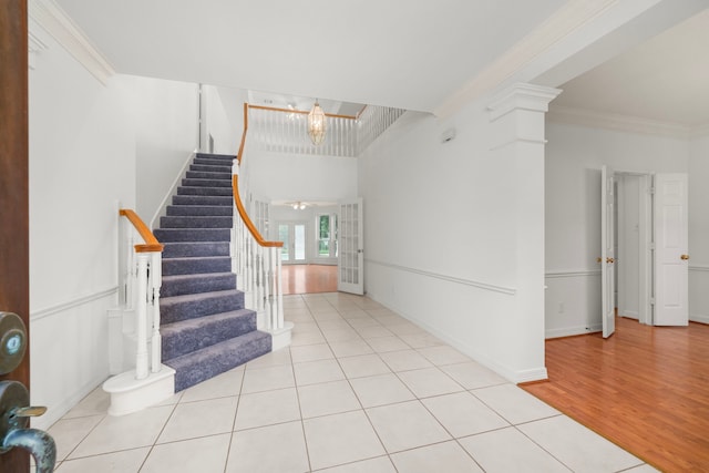 1922 Stormcroft Cir, Katy, TX 77450 - tiled entryway with stairway, crown molding, and a chandelier