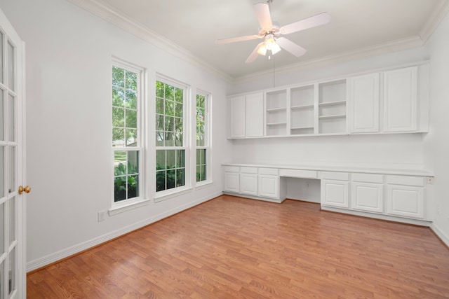 1922 Stormcroft Cir, Katy, TX 77450 - unfurnished office featuring built in desk, light wood-type flooring, ornamental molding, and a ceiling fan