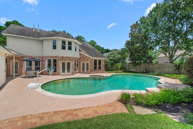 1922 Stormcroft Cir, Katy, TX 77450 - view of pool featuring french doors, a patio, a fenced backyard, and a pool with connected hot tub