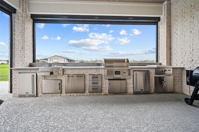 14923 Old Irish Farm Rd, Baytown, TX 77523 - view of patio featuring an outdoor kitchen and a sink