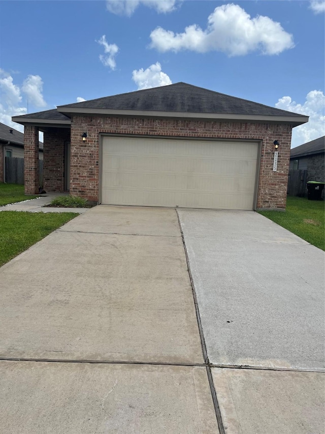 2135 Republic Way, Missouri City, TX 77489 - ranch-style house featuring concrete driveway, an attached garage, brick siding, and a shingled roof