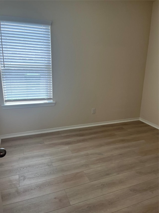 2135 Republic Way, Missouri City, TX 77489 - empty room with baseboards and wood finished floors