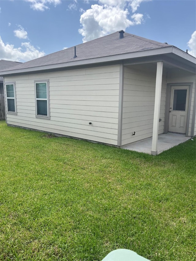 2135 Republic Way, Missouri City, TX 77489 - view of side of home featuring a yard and a patio