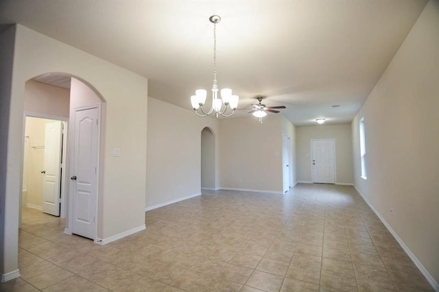 2135 Republic Way, Missouri City, TX 77489 - unfurnished room with arched walkways, ceiling fan, light tile patterned floors, and a chandelier