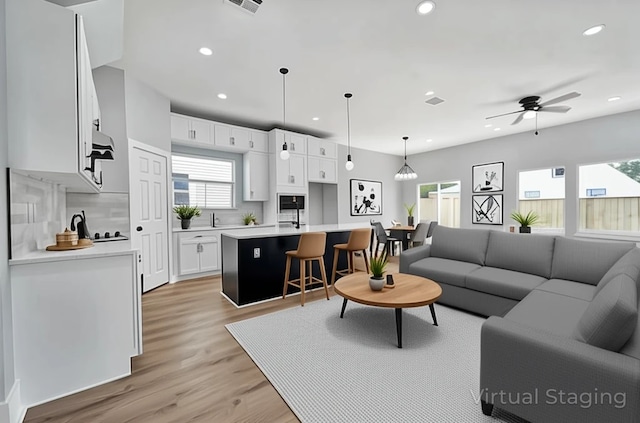 16362 Eastchase St, Montgomery, TX 77316 - living area featuring recessed lighting, light wood-type flooring, and ceiling fan