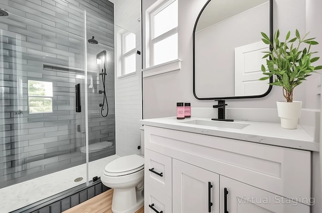 16362 Eastchase St, Montgomery, TX 77316 - full bathroom with plenty of natural light, vanity, a shower stall, and wood finished floors