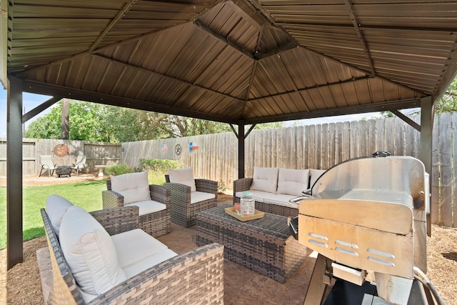 3426 Satton Ranch Ln, Fulshear, TX 77441 - fenced backyard with an outdoor hangout area, grilling area, and a patio area
