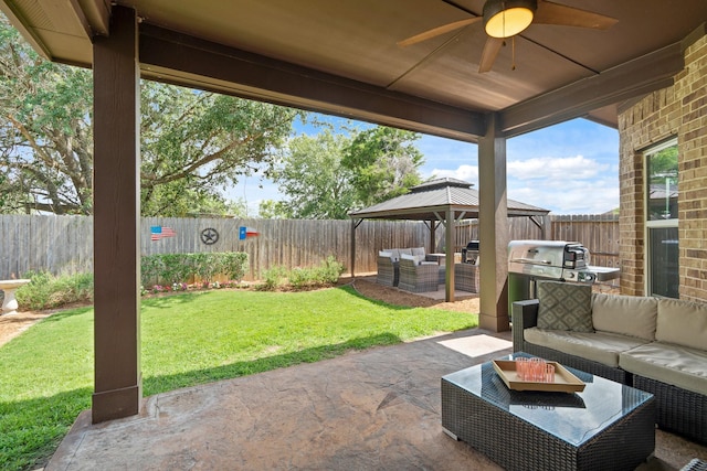 3426 Satton Ranch Ln, Fulshear, TX 77441 - fenced backyard with an outdoor hangout area, a gazebo, a patio area, a ceiling fan, and a grill
