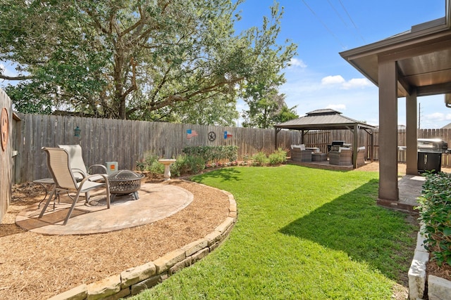 3426 Satton Ranch Ln, Fulshear, TX 77441 - fenced backyard with a gazebo, a patio area, and an outdoor living space with a fire pit