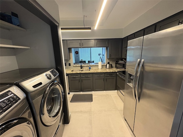3244 Poe Dr, Montgomery, TX 77356 - washroom featuring independent washer and dryer and light tile patterned floors