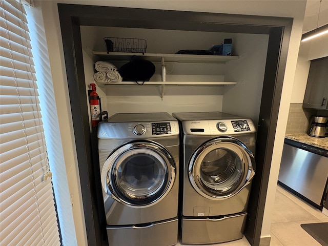 3244 Poe Dr, Montgomery, TX 77356 - washroom featuring washer and dryer and light tile patterned floors
