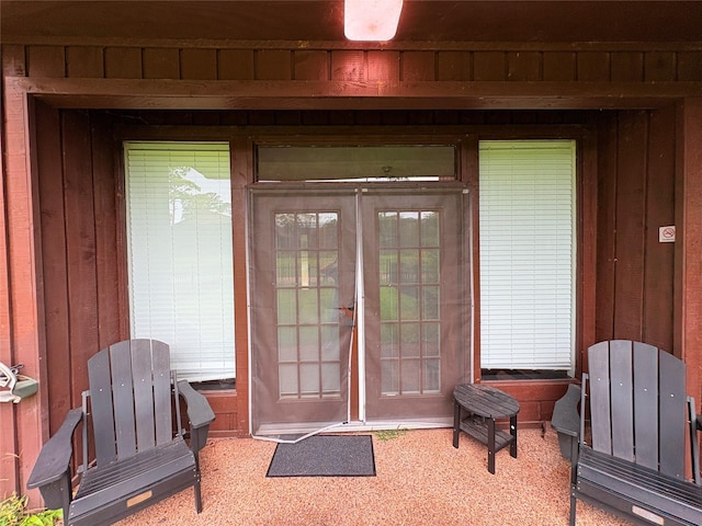 3244 Poe Dr, Montgomery, TX 77356 - view of exterior entry featuring board and batten siding and french doors
