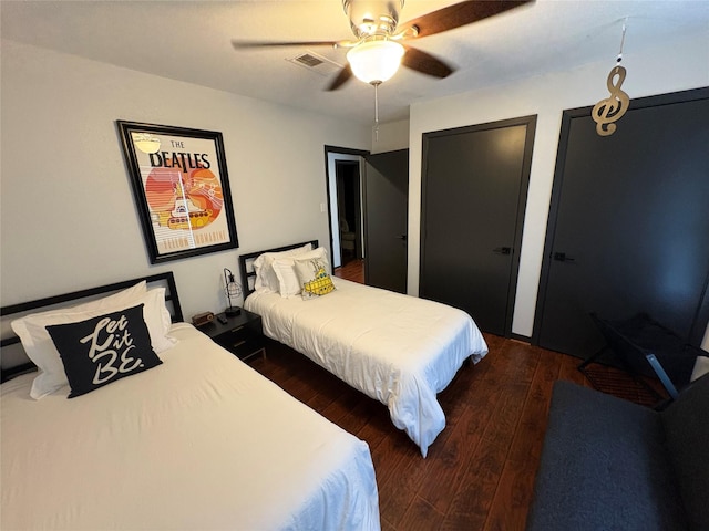 3244 Poe Dr, Montgomery, TX 77356 - bedroom with hardwood / wood-style floors, a ceiling fan, and two closets