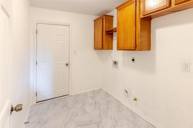 214 Balsam St, Lake Jackson, TX 77566 - laundry area featuring hookup for an electric dryer, washer hookup, cabinet space, light marble finish floors, and hookup for a gas dryer