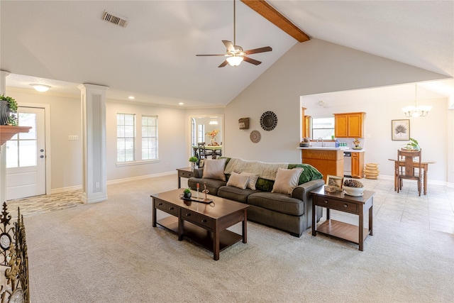 214 Balsam St, Lake Jackson, TX 77566 - living area featuring high vaulted ceiling, ceiling fan, beamed ceiling, light colored carpet, and decorative columns