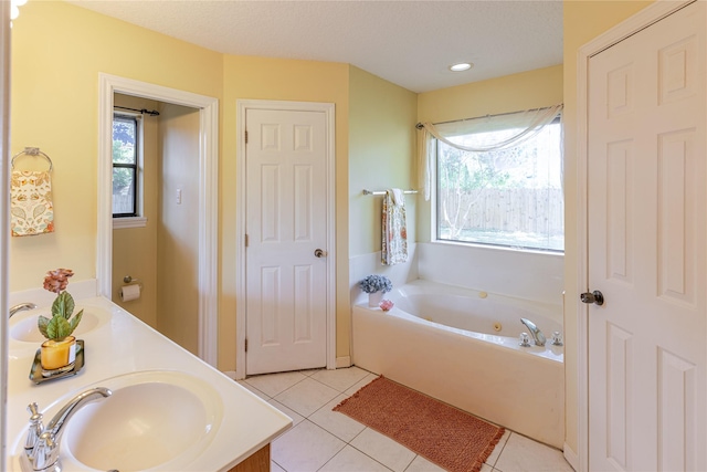 214 Balsam St, Lake Jackson, TX 77566 - full bathroom featuring double vanity, a jetted tub, tile patterned flooring, and plenty of natural light