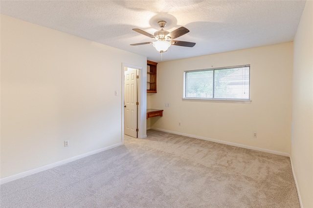 214 Balsam St, Lake Jackson, TX 77566 - empty room featuring light colored carpet, a ceiling fan, and a textured ceiling