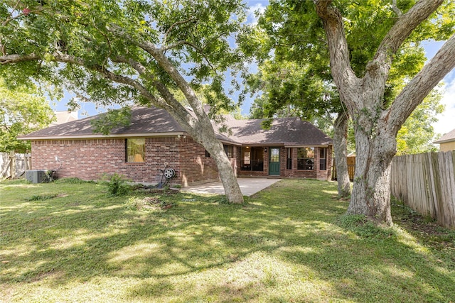 214 Balsam St, Lake Jackson, TX 77566 - rear view of property with brick siding, a fenced backyard, a patio area, and roof with shingles