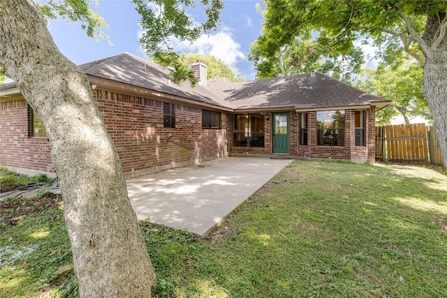 214 Balsam St, Lake Jackson, TX 77566 - rear view of property with brick siding, a chimney, a patio, and a shingled roof