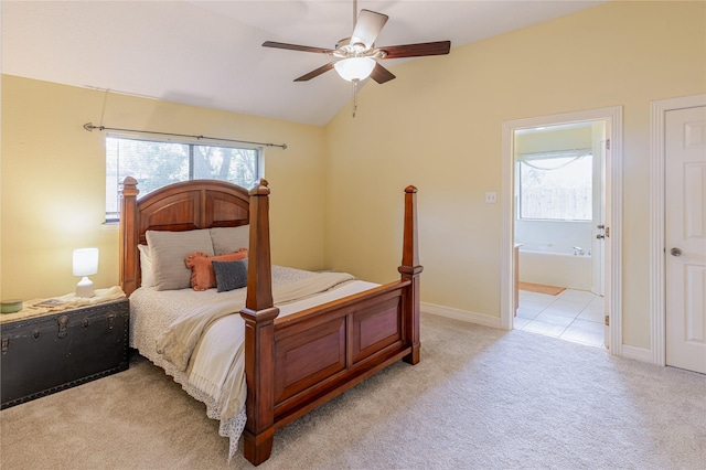 214 Balsam St, Lake Jackson, TX 77566 - bedroom featuring multiple windows, light carpet, vaulted ceiling, ensuite bathroom, and ceiling fan