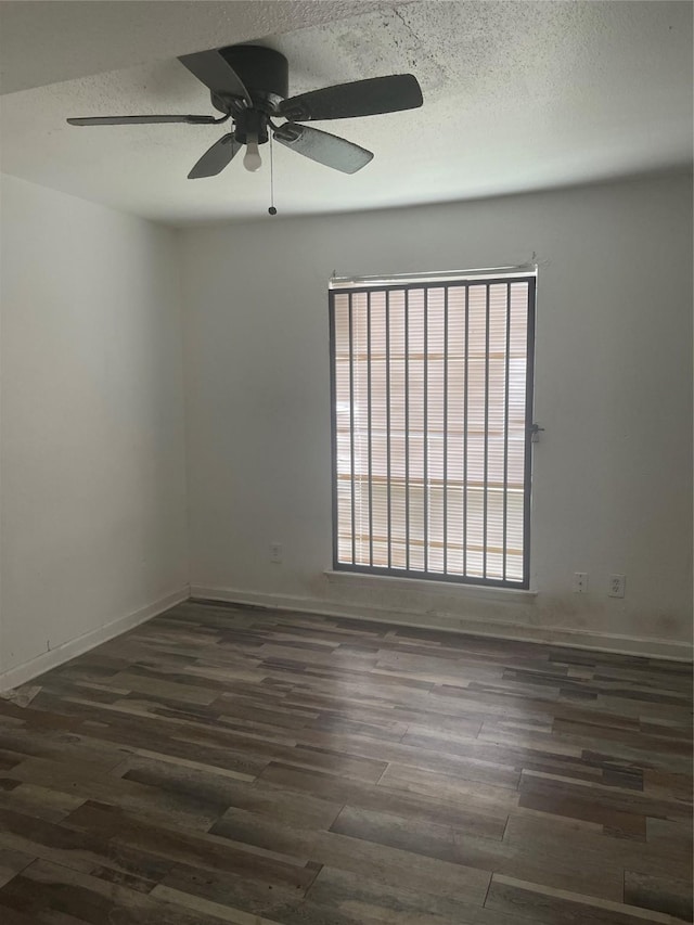 5625 Antoine Dr Unit 1011, Houston, TX 77091 - unfurnished room with dark wood finished floors, a ceiling fan, and a textured ceiling