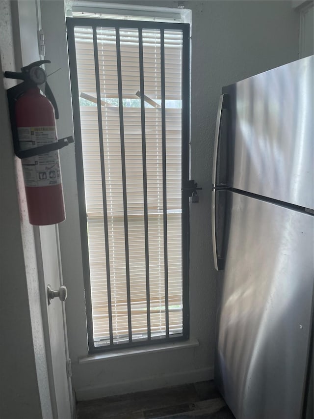 5625 Antoine Dr Unit 1011, Houston, TX 77091 - detailed view of freestanding refrigerator and a fire extinguisher