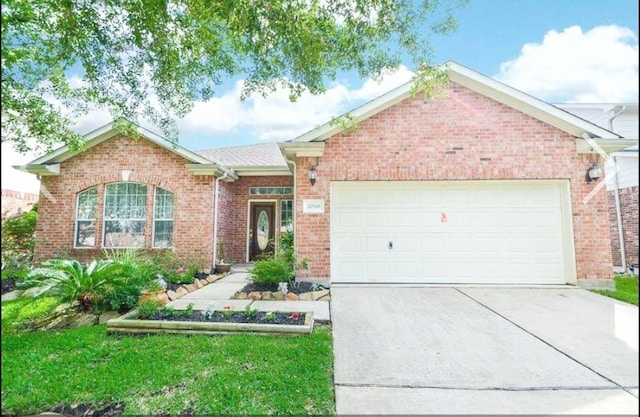 20518 Bonds Creek Ln, Spring, TX 77388 - single story home featuring driveway, an attached garage, and brick siding
