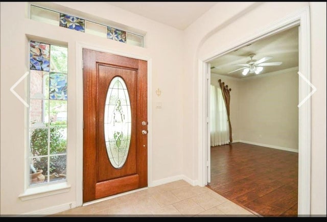 20518 Bonds Creek Ln, Spring, TX 77388 - entrance foyer featuring a ceiling fan, wood finished floors, and crown molding