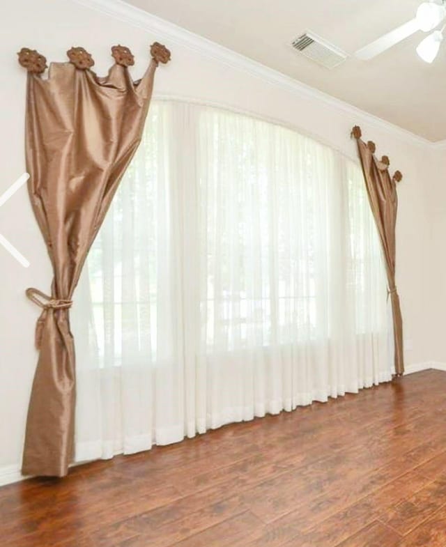 20518 Bonds Creek Ln, Spring, TX 77388 - unfurnished living room with wood finished floors, ceiling fan, and crown molding