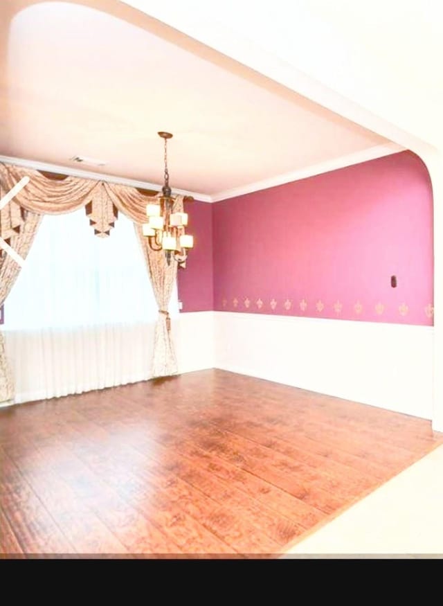 20518 Bonds Creek Ln, Spring, TX 77388 - spare room featuring wood finished floors, a chandelier, and crown molding
