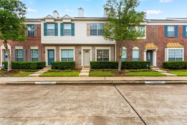 2930 Grants Lake Blvd Unit 2404, Sugar Land, TX 77479 - view of front of house with uncovered parking, entry steps, and brick siding