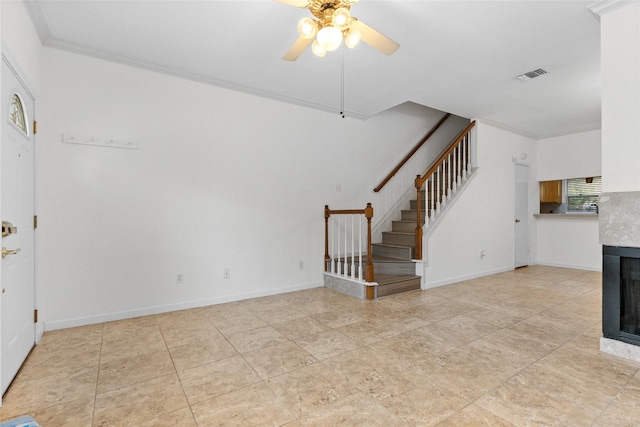 2930 Grants Lake Blvd Unit 2404, Sugar Land, TX 77479 - unfurnished living room with a ceiling fan, stairs, ornamental molding, and a tile fireplace