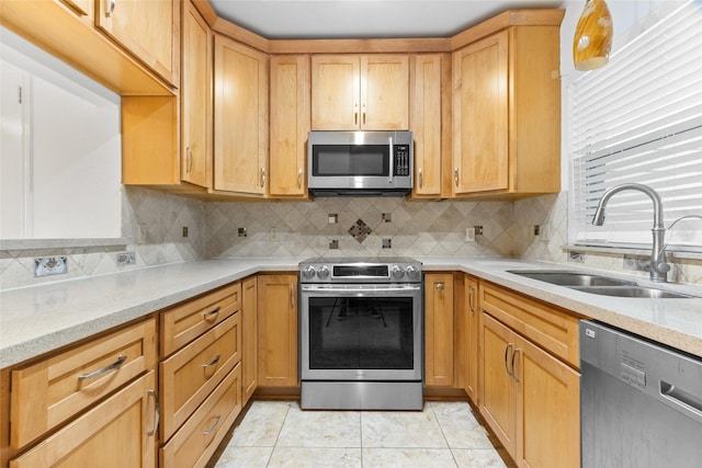 2930 Grants Lake Blvd Unit 2404, Sugar Land, TX 77479 - kitchen with stainless steel appliances, backsplash, light stone countertops, and light tile patterned floors