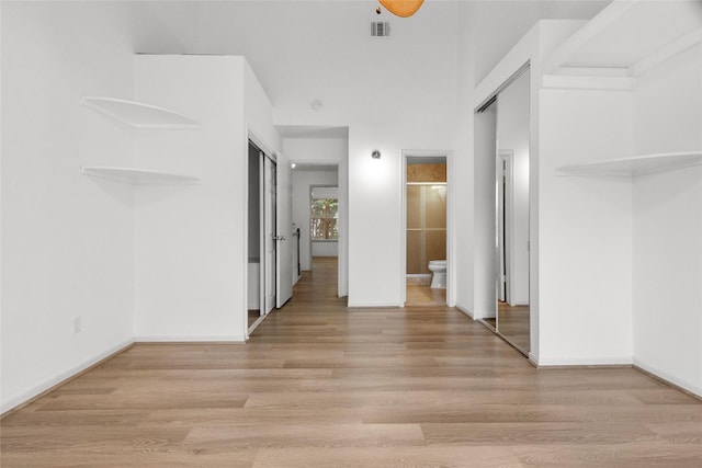 2930 Grants Lake Blvd Unit 2404, Sugar Land, TX 77479 - unfurnished bedroom with light wood-style floors and connected bathroom