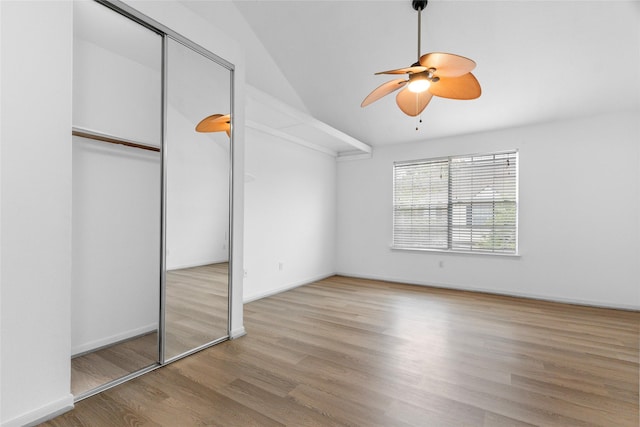 2930 Grants Lake Blvd Unit 2404, Sugar Land, TX 77479 - unfurnished bedroom with wood finished floors, vaulted ceiling, ceiling fan, and a closet