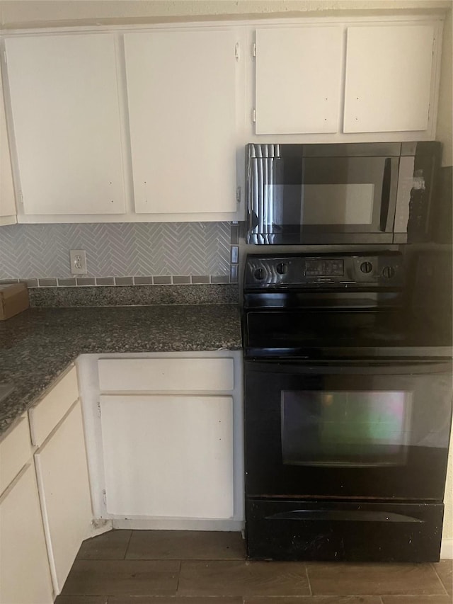 5625 Antoine Dr Unit 1405, Houston, TX 77091 - kitchen featuring oven, white cabinets, decorative backsplash, and dark wood finished floors