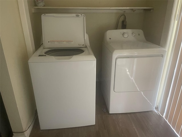 5625 Antoine Dr Unit 1405, Houston, TX 77091 - laundry room with washer and clothes dryer and wood finish floors