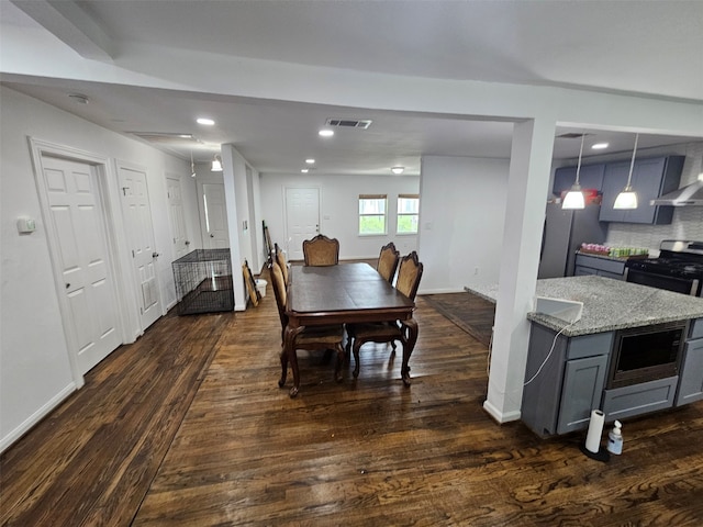 907 Whitaker Ave, Pasadena, TX 77506 - dining space with dark wood-type flooring and recessed lighting