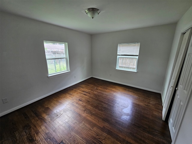 907 Whitaker Ave, Pasadena, TX 77506 - spare room with dark wood finished floors and baseboards