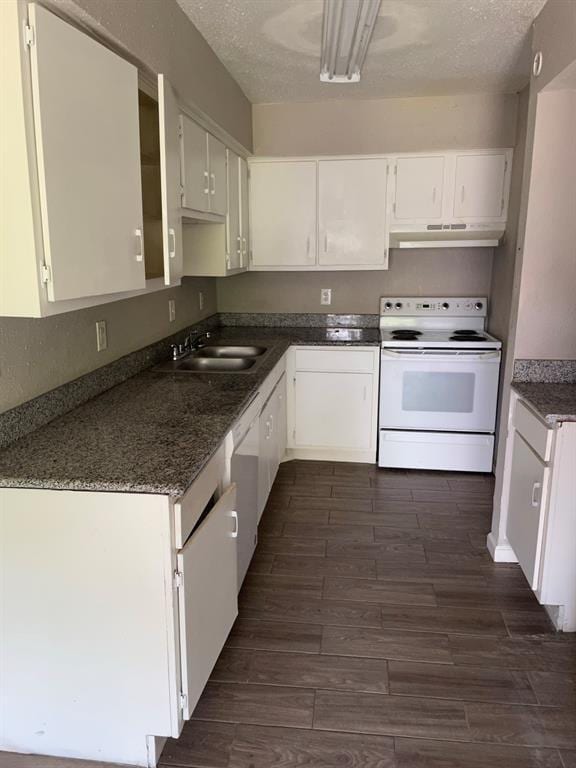 5625 Antoine Dr Unit 1406, Houston, TX 77091 - kitchen featuring white appliances, under cabinet range hood, dark wood-style flooring, white cabinets, and a textured ceiling