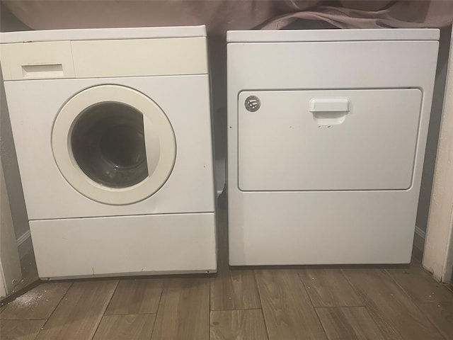 5625 Antoine Dr Unit 1406, Houston, TX 77091 - laundry room featuring wood finished floors and washer and dryer