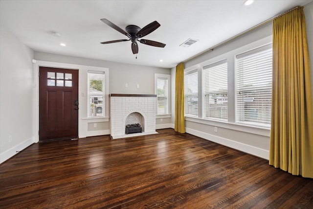5001 Farmer St, Houston, TX 77020 - unfurnished living room featuring ceiling fan, wood finished floors, a fireplace, and recessed lighting