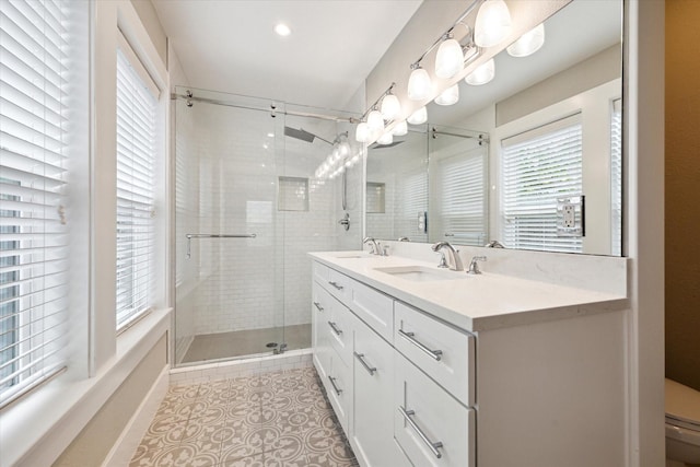 5001 Farmer St, Houston, TX 77020 - full bath with a shower stall, plenty of natural light, double vanity, and tile patterned flooring