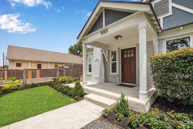 5001 Farmer St, Houston, TX 77020 - doorway to property with covered porch and brick siding