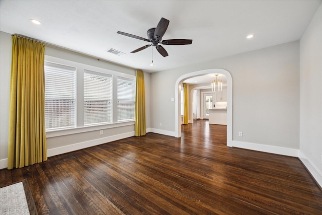 5001 Farmer St, Houston, TX 77020 - unfurnished room featuring ceiling fan, arched walkways, wood finished floors, and recessed lighting