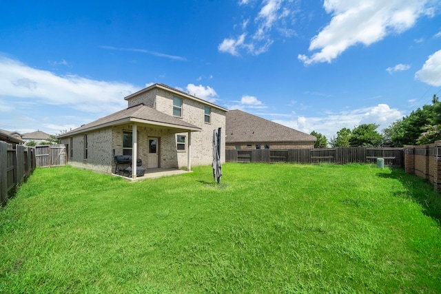 6406 Shadowbrook Hollow Trl, Katy, TX 77493 - rear view of house with a fenced backyard, a patio area, and brick siding