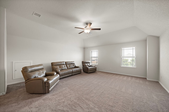 6406 Shadowbrook Hollow Trl, Katy, TX 77493 - living area with ceiling fan, carpet flooring, vaulted ceiling, and a textured ceiling